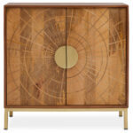 Zera 2 Door Sideboard. Carved mango wood sideboard. Natural wood storage unit. Gold leg sideboard. Modern dining room furniture. Contemporary mango wood cabinet. Handcrafted furniture. Luxury wooden sideboard. Sustainable home décor. Mango wood console. Elegant living room furniture. Gold metal frame sideboard. Artisan carved design. Minimalist storage cabinet. Eco-friendly wooden furniture. Boho chic sideboard. Durable modern furniture. Boutique style home decor. Rustic modern wood sideboard. Timeless furniture design.