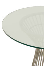 Kaya Glass Dining Table. Round glass dining table. Silver stainless steel base. Modern dining furniture. Art deco dining table. Luxury dining room design. Contemporary glass table. Geometric metal base table. Sleek modern dining set. Reflective silver furniture. Boutique home décor. Minimalist dining table. Clear glass tabletop. Modern round table. Durable stainless steel frame. Elegant dining furniture. Stylish home interiors. Opulent dining design. Statement dining table. Timeless modern décor.