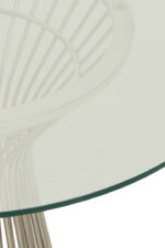 Kaya Glass Dining Table. Round glass dining table. Silver stainless steel base. Modern dining furniture. Art deco dining table. Luxury dining room design. Contemporary glass table. Geometric metal base table. Sleek modern dining set. Reflective silver furniture. Boutique home décor. Minimalist dining table. Clear glass tabletop. Modern round table. Durable stainless steel frame. Elegant dining furniture. Stylish home interiors. Opulent dining design. Statement dining table. Timeless modern décor.