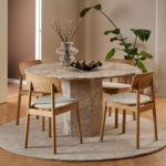 Round marble dining table. Travertine dining table. Brown marble table. Luxury dining furniture. Stone dining table. Modern dining table. Pillar base table. Contemporary dining room furniture. Statement dining table. Seating for five.