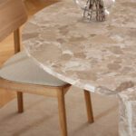 Round marble dining table. Travertine dining table. Brown marble table. Luxury dining furniture. Stone dining table. Modern dining table. Pillar base table. Contemporary dining room furniture. Statement dining table. Seating for five.