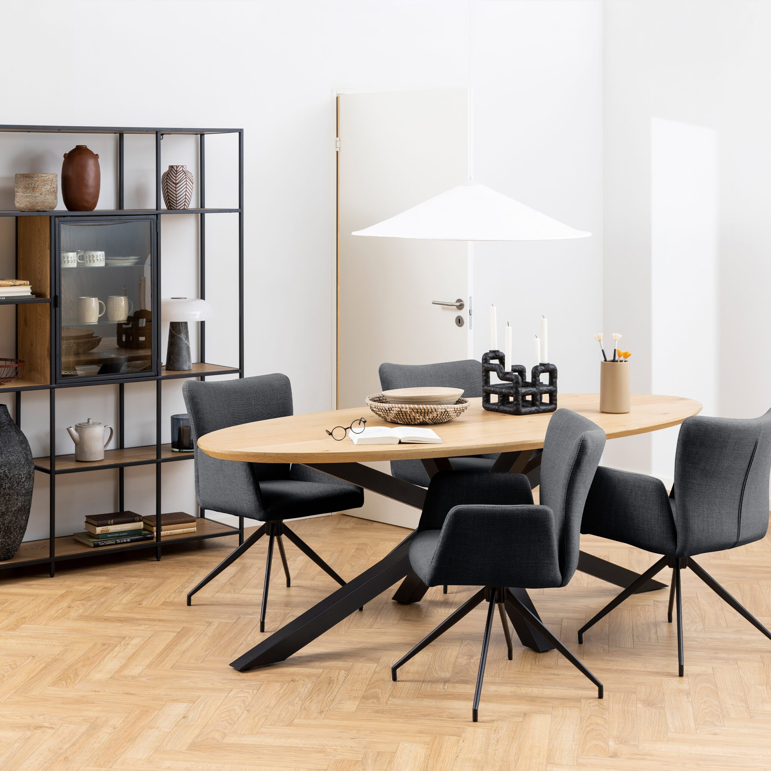 Marlin Oval Dining Table oval dining table. oak dining table. large dining table. 10 seater dining table. black metal dining table. cross base dining table. modern dining furniture. contemporary dining table. wooden dining table. organic shape dining table. statement dining table. family dining table. Marlin dining table.