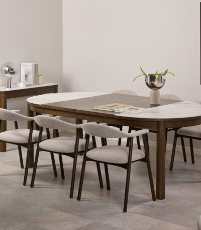 tending dining table. Ceramic top dining table. Modern dining table. Extendable table. Heat resistant dining surface. Scratch resistant tabletop. Contemporary dining furniture. Round extending table. Space saving dining table. Family dining table.