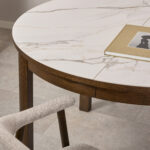 tending dining table. Ceramic top dining table. Modern dining table. Extendable table. Heat resistant dining surface. Scratch resistant tabletop. Contemporary dining furniture. Round extending table. Space saving dining table. Family dining table.