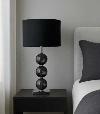 Alora Orb Table Lamp. Chrome table lamp. Glass orb lamp. Cream orb lamp. Black orb lamp. Modern bedside lighting. Elegant home décor. Contemporary table lamp. Reflective base lamp.