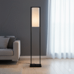 Arvis Iron Frame Floor Lamp. Modern floor lamp. Black iron frame lamp. White linen shade lighting. Minimalist home lighting. Contemporary floor lamp. Living room lighting. Bedroom floor light. Scandinavian lighting. Industrial modern décor. Sleek black lamp. Designer standing lamp. Ambient lighting solution. Boutique home décor.