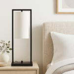 Arvis Iron Frame Table Lamp. Modern table lamp. Black iron lamp. White linen shade lamp. Minimalist lighting. Contemporary home décor. Bedroom table lamp. Living room lighting. Office desk lamp. Modern industrial style lamp. Sleek black metal lamp. Ambient light feature. Designer lamp. Elegant minimalist lighting.