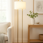 Camden Curved Floor Lamp. Gold floor lamp. White marble base lamp. Curved metal lamp. Modern floor lighting. Luxury home decor. Gold and white lamp. Elegant standing lamp. Minimalist floor light. Contemporary lighting design. Living room lamp. Bedroom floor light. Designer lighting piece. Modern home accessories.