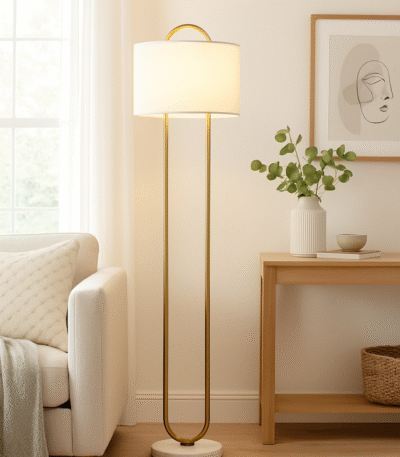 Camden Curved Floor Lamp. Gold floor lamp. White marble base lamp. Curved metal lamp. Modern floor lighting. Luxury home decor. Gold and white lamp. Elegant standing lamp. Minimalist floor light. Contemporary lighting design. Living room lamp. Bedroom floor light. Designer lighting piece. Modern home accessories.
