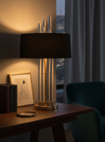 Corey Glass Rods Table Lamp. Art deco table lamp. Silver table lamp. Gold finish lamp. Glass rod lighting. Modern decorative lighting. White or black fabric shade. Luxury home décor lamp. Sculptural metal lamp. Ambient living room lighting. Contemporary bedside table lamp. Reflective metallic base. Designer statement lighting. Boutique interior accessory.