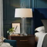 Corey Glass Rods Table Lamp. Art deco table lamp. Silver table lamp. Gold finish lamp. Glass rod lighting. Modern decorative lighting. White or black fabric shade. Luxury home décor lamp. Sculptural metal lamp. Ambient living room lighting. Contemporary bedside table lamp. Reflective metallic base. Designer statement lighting. Boutique interior accessory.