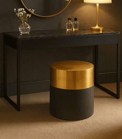 Corina Round Shagreen Stool. Round shagreen stool. Luxury accent stool. Black and gold stool. Textured leather stool. Modern footstool. Art deco stool. Bedroom accent stool. Living room stool. Boutique style furniture. Luxury seating. Contemporary home furniture. Designer stool. Metallic base stool. Compact accent furniture.