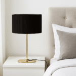 Forma Table Lamp. Gold table lamp. Silver table lamp. Ribbed shade lamp. Modern lighting. Contemporary décor. Metallic base lamp. Elegant bedside light. Luxury home accessory.