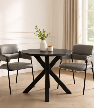 Halvar Round Dining Table. Black wood dining table. Modern dining table. Round dining table. Contemporary dining furniture. Black veneer top. Powder-coated legs. Scandinavian style table. Elegant dining design.