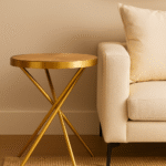 June Round Side Table. Modern side table. Gold finish table. Stainless steel frame. Sculptural base table. Aged fir wood top. Luxury accent table. Contemporary furniture. Small round table. Wooden top side table. Gold legs table. Modern living room décor. Glam side table. Natural wood furniture. Metal and wood table. Designer side table. Chic end table. Minimalist gold table. Round accent furniture. Elegant home décor.