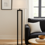 Kenton Monochromatic Floor Lamp. Black and white floor lamp. Modern standing lamp. Minimalist lighting. Contemporary home décor. Black metal frame lamp. White tapered shade. Elegant monochrome lamp. Ambient lighting solution. Modern living room floor lamp. Designer home accessory. Sleek contemporary floor lamp.