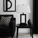 Kenton Monochromatic Table Lamp. Black and white table lamp. Modern desk lamp. Minimalist lighting. Contemporary bedside lamp. Black metal frame. White tapered shade. Monochrome design. Elegant modern lighting. Ambient home lighting. Bedroom lamp. Living room table lamp. Designer home accessory. Sleek decorative lamp.