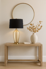 Malden Amber Glass Table Lamp. Amber glass table lamp. Gold base table lamp. Black fabric shade lamp. Luxury glass lighting. Modern amber lamp. Elegant bedside lamp. Contemporary table lamp. Living room lighting. Designer glass lamp. Warm glow lamp. Gold and black table lamp. Sculptural glass base lamp. Decorative lighting. Luxury home décor. Modern classic table lamp. Stylish desk lamp. Glass and metal lamp. Ambient lighting solution. Boutique home lighting.