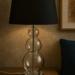 Marn 3 Orb Table Lamp. Silver table lamp. Glass orb lamp. Black shade table lamp. Grey shade lamp. Modern bedside lighting. Contemporary home décor. Elegant lighting. Reflective base lamp.