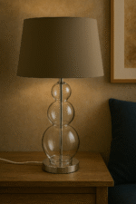 Marn 3 Orb Table Lamp. Silver table lamp. Glass orb lamp. Black shade table lamp. Grey shade lamp. Modern bedside lighting. Contemporary home décor. Elegant lighting. Reflective base lamp.