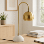 Miller Globe Table Lamp. Modern desk lamp. Gold finish table lamp. White marble base lamp. Semi globe shade lighting. Adjustable reading lamp. Contemporary lighting. Brass metal lamp. Elegant home décor. Designer lighting piece. Mid century modern lamp.