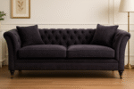 Naya 2 Seater Chesterfield Sofa. Dark grey velvet sofa. Velvet chesterfield sofa. 2 seater chesterfield. Classic velvet sofa. Button tufted sofa. Modern chesterfield couch. Traditional style sofa. Compact velvet sofa. Elegant grey sofa. Living room seating. Luxury velvet furniture. Grey chesterfield loveseat. Castor leg sofa. Plush velvet sofa.