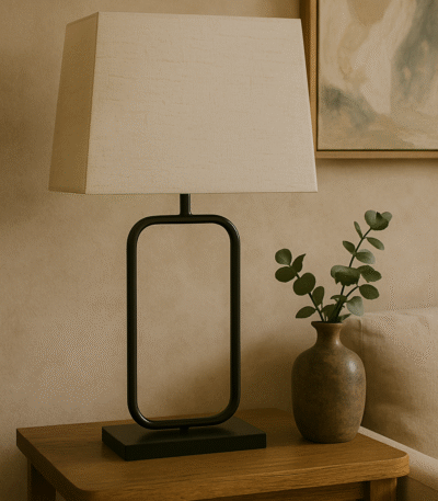 Nexa Table Lamp. Black metal lamp. Modern table lamp. Minimalist lighting. Natural fabric shade. Scandinavian lamp. Contemporary home décor. Rectangular frame lamp. Elegant lighting design.