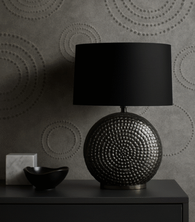 Omi Hammered Table Lamp. Silver table lamp. Hammered metal lamp. Black fabric shade. Modern lighting. Contemporary décor. Textured base lamp. Reflective lamp. Elegant home lighting. Chrome.