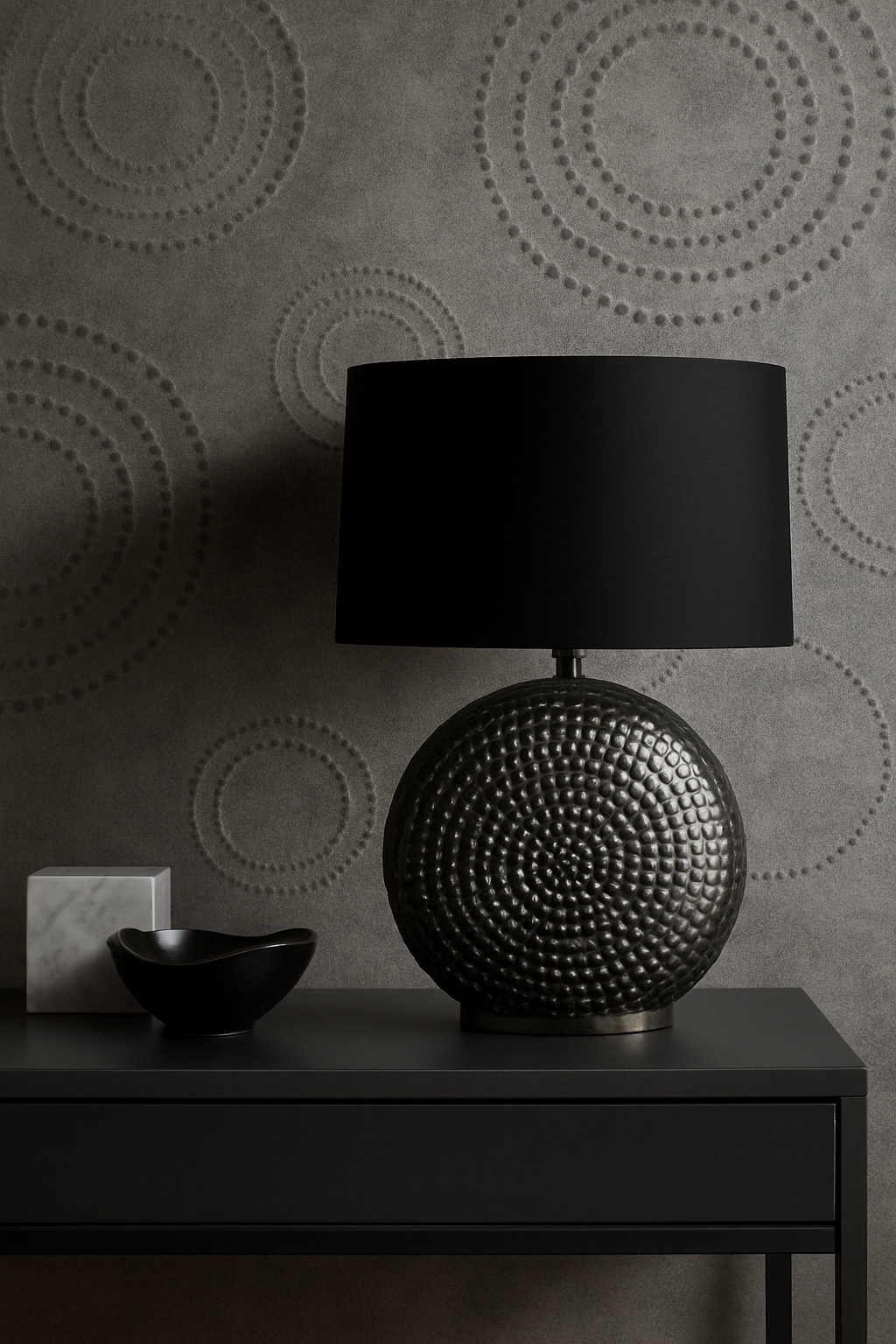 Omi Hammered Table Lamp Omi Hammered Table Lamp. Silver table lamp. Hammered metal lamp. Black fabric shade. Modern lighting. Contemporary décor. Textured base lamp. Reflective lamp. Elegant home lighting. Chrome.