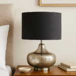 Reign Silver Table Lamp. Silver glass lamp. Black linen shade lamp. Modern table lamp. Metallic home décor. Contemporary lighting. Elegant bedside lamp. Luxe accent lighting.