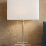 Rue Rectangular Table Lamp. Crystal table lamp. Chrome finish lamp. Rectangular lamp base. Modern lighting. Luxury home décor. Elegant bedside lamp. Contemporary glass lamp. White fabric shade.