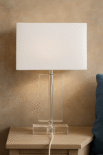 Rue Rectangular Table Lamp. Crystal table lamp. Chrome finish lamp. Rectangular lamp base. Modern lighting. Luxury home décor. Elegant bedside lamp. Contemporary glass lamp. White fabric shade.