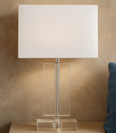 Rue Rectangular Table Lamp. Crystal table lamp. Chrome finish lamp. Rectangular lamp base. Modern lighting. Luxury home décor. Elegant bedside lamp. Contemporary glass lamp. White fabric shade.