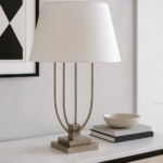 Silo Curved Table Lamp. Satin nickel lamp. Modern table lamp. Boutique lighting. White shade lamp. Silver base lamp. Contemporary home décor. Sculptural table lamp. Pagoda-inspired design.