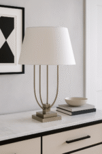 Silo Curved Table Lamp. Satin nickel lamp. Modern table lamp. Boutique lighting. White shade lamp. Silver base lamp. Contemporary home décor. Sculptural table lamp. Pagoda-inspired design.