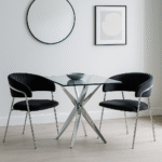 Taryn Velvet Dining Chair. Modern dining chair. Gold finish dining chair. Chrome dining chair. Mink velvet chair. Black velvet chair. Luxury velvet seating. Contemporary dining furniture. Upholstered dining chair. Padded velvet chair. Elegant dining room chair. Modern home décor. Gold metal legs chair. Chrome base dining chair. Velvet accent seating. Stylish dining furniture. Glam dining room chair. Minimal design dining chair. Velvet dining room decor. Modern luxury chair.