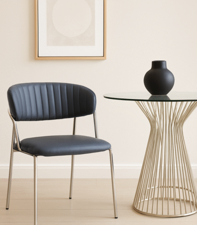 Taryn Leather Dining Chair. Grey leather dining chair. Modern dining chair. Chrome leg dining chair. Contemporary leather chair. Padded dining chair. Tufted backrest chair. Minimalist dining furniture. Ergonomic dining chair. Stylish grey chair. Luxury dining seating. Metal frame dining chair. Modern kitchen chair. Easy clean leather chair. Industrial dining chair. Sleek dining chair. Compact dining chair. Modern home furniture. Comfortable dining chair. Dark grey upholstered chair.