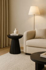 Tova Carved Ridge Side Table. Black mango wood table. Eco-friendly side table. Modern carved table. Ridged base furniture. Handcrafted wooden table. Sculptural side table. Minimalist bowl top table. Sustainable mango wood furniture. Black wood accent table. Contemporary living room furniture. Artisanal wooden side table. Textured modern furniture. Round mango wood side table. Luxury handcrafted decor.