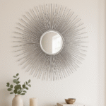 Voss Silver Sunburst Wall Mirror. Silver wall mirror. Sunburst mirror design. Modern wall décor. Round decorative mirror. Iron frame mirror. Contemporary silver décor. Reflective wall art. Statement mirror.