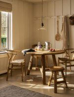 Hawthorne Round Dining Table. Reclaimed teak dining table. Round wooden dining table. Rustic dining table. Indonesian teak furniture. Sustainable dining table. Natural wood round table. Farmhouse round dining table. Rustic kitchen table. Solid teak round table. Reclaimed wood furniture. Four to six seater dining table. Textured wood dining table. Durable teak table. Eco-friendly dining furniture.