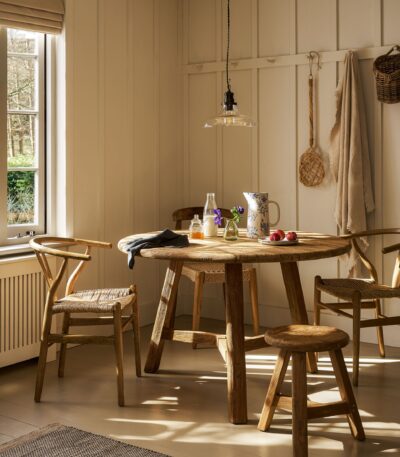 Hawthorne Round Dining Table. Reclaimed teak dining table. Round wooden dining table. Rustic dining table. Indonesian teak furniture. Sustainable dining table. Natural wood round table. Farmhouse round dining table. Rustic kitchen table. Solid teak round table. Reclaimed wood furniture. Four to six seater dining table. Textured wood dining table. Durable teak table. Eco-friendly dining furniture.