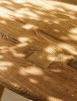 Hawthorne Round Dining Table. Reclaimed teak dining table. Round wooden dining table. Rustic dining table. Indonesian teak furniture. Sustainable dining table. Natural wood round table. Farmhouse round dining table. Rustic kitchen table. Solid teak round table. Reclaimed wood furniture. Four to six seater dining table. Textured wood dining table. Durable teak table. Eco-friendly dining furniture.