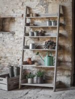 Aldsworth Wide Shelf Ladder Unit. Wooden ladder shelf. Rustic ladder shelving. Spruce shelf unit. Indoor outdoor ladder shelf. Plant ladder stand. Rustic bookshelf. Wide ladder display unit. Farmhouse style shelving. Kitchen ladder shelf. Potting shed storage. Home décor ladder shelf. Natural wood shelving unit. Folding ladder shelf. Decorative wooden ladder.