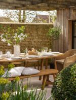 Hawthorne Oval Dining Table. Reclaimed teak dining table. Oval wooden dining table. Large rustic dining table. Indoor outdoor dining table. Indonesian teak furniture. Sustainable dining furniture. Weatherproof teak table. Farmhouse style dining table. Rustic oval table. Natural wood dining table. Eight seater dining table. Solid teak table. Textured wood table. Eco-friendly dining table.