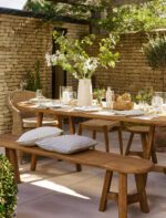 Hawthorne Oval Dining Table. Reclaimed teak dining table. Oval wooden dining table. Large rustic dining table. Indoor outdoor dining table. Indonesian teak furniture. Sustainable dining furniture. Weatherproof teak table. Farmhouse style dining table. Rustic oval table. Natural wood dining table. Eight seater dining table. Solid teak table. Textured wood table. Eco-friendly dining table.