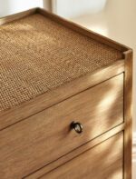 Chesterton Chest of Drawers. Wooden chest of drawers. Natural wood drawers. Rattan top drawers. Bayur wood furniture. Mindi veneer drawers. Brass handle chest. Wooden drawer unit. Bedroom storage drawers. Living room storage furniture. Handcrafted wood chest. Rustic bedroom furniture. Warm wood furniture. Solid wood drawers. Modern natural storage.