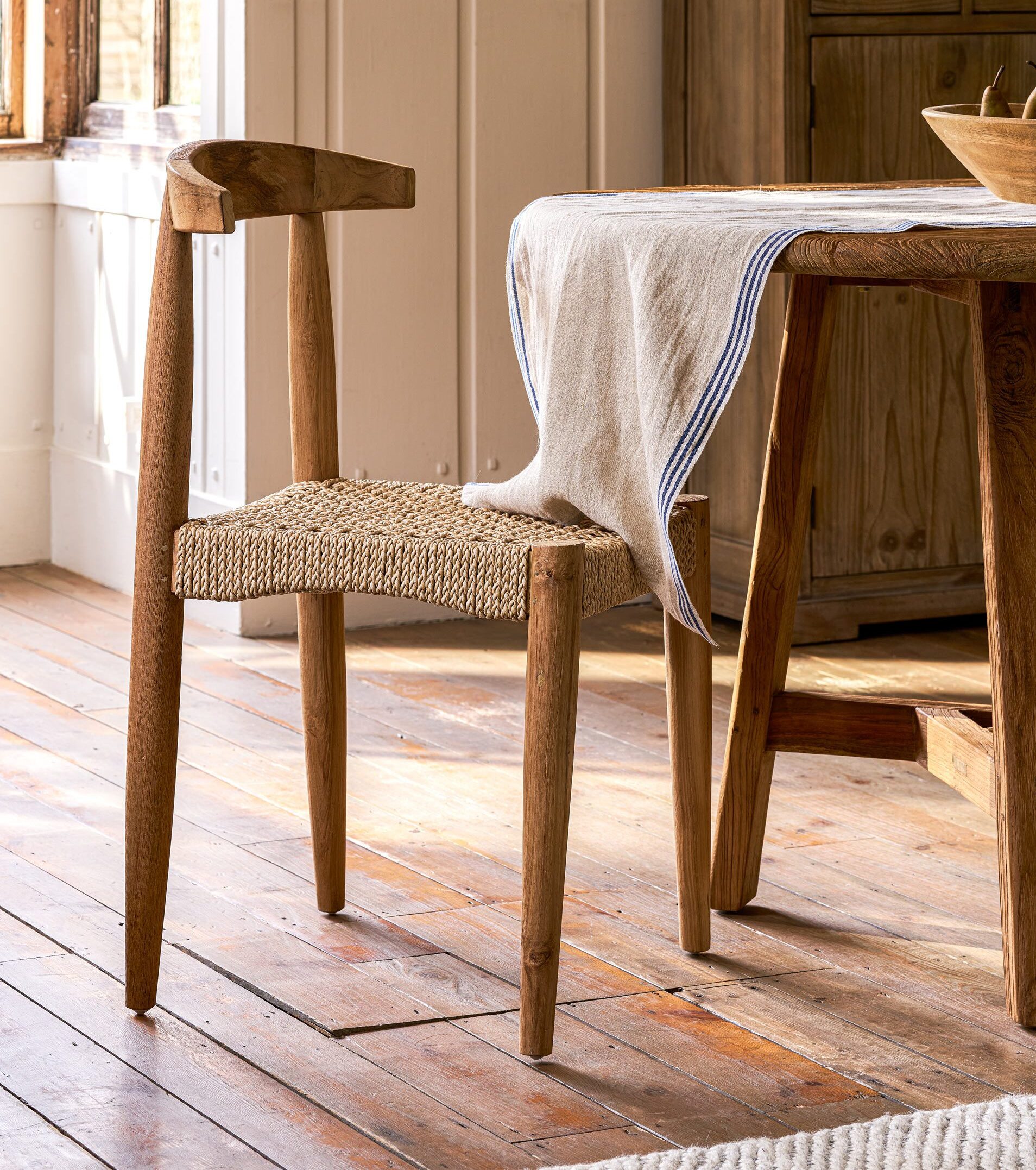 Hawthorne Set of 2 Dining Chairs Hawthorne Set of 2 Dining Chairs. Reclaimed teak dining chairs. Teak and hyacinth chairs. Indoor outdoor dining chairs. Rustic wooden chairs. Sustainable dining furniture. Indonesian teak chairs. Natural woven seat chairs. Farmhouse dining chairs. Rustic dining room seating. Patio dining chairs. Eco-friendly furniture. Teak chair set. Weatherproof teak chairs. Handcrafted dining chairs.