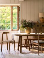 Hawthorne Oval Dining Table. Reclaimed teak dining table. Oval wooden dining table. Large rustic dining table. Indoor outdoor dining table. Indonesian teak furniture. Sustainable dining furniture. Weatherproof teak table. Farmhouse style dining table. Rustic oval table. Natural wood dining table. Eight seater dining table. Solid teak table. Textured wood table. Eco-friendly dining table.