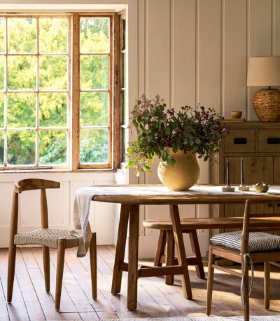 Hawthorne Oval Dining Table. Reclaimed teak dining table. Oval wooden dining table. Large rustic dining table. Indoor outdoor dining table. Indonesian teak furniture. Sustainable dining furniture. Weatherproof teak table. Farmhouse style dining table. Rustic oval table. Natural wood dining table. Eight seater dining table. Solid teak table. Textured wood table. Eco-friendly dining table.