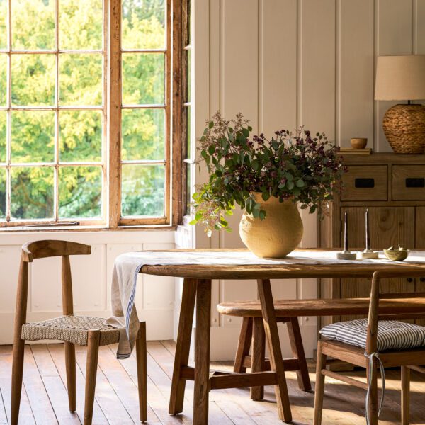 Hawthorne Oval Dining Table. Reclaimed teak dining table. Oval wooden dining table. Large rustic dining table. Indoor outdoor dining table. Indonesian teak furniture. Sustainable dining furniture. Weatherproof teak table. Farmhouse style dining table. Rustic oval table. Natural wood dining table. Eight seater dining table. Solid teak table. Textured wood table. Eco-friendly dining table.